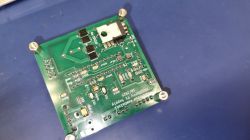 Soldered custom PCB for Raspberry Pi power supply Soldered PCB board with electronic components on a blue antistatic surface