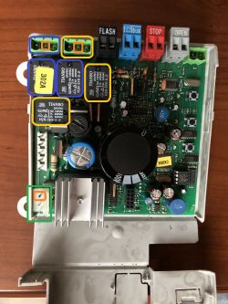 Controller board with highlighted power connector and components.
