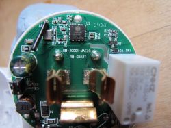 Interior of RMC003 Smart Plug with PCB Close-up of the interior of a smart plug with visible PCB and Lightning Semi LN882HKI component.