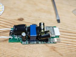 Espressif Module on Circuit Board Electronic module with visible capacitors and Espressif chip on a circuit board.