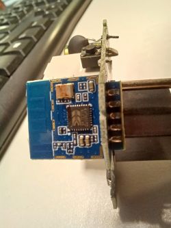 Close-up of an open electronic device with a visible circuit board and electronic components.