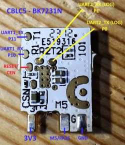 CBLC5 module with pin labels for UART, power, and reset on a wooden surface