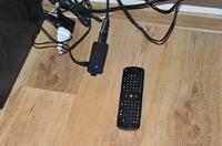 How can I stream footage from a camera at work to my TV at home via the internet?