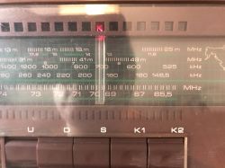 Front Panel of Unitra Sudety R-208 Radio Close-up of the front panel of a Unitra Sudety R-208 radio with visible scales and band selection buttons.