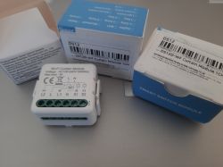 Wi-Fi Curtain Module DS12 and packaging Wi-Fi curtain control module and three boxes labeled Smart Switch Module.