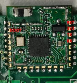 WiFi Relay Circuit Board with Labeled Pins Close-up of a circuit board with labeled pins: BOOT, RST, 3V3, TX, RX.