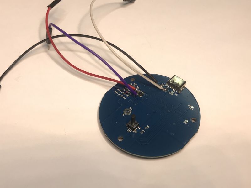 Round PCB with connected wires and a micro USB port for IR Tuya device