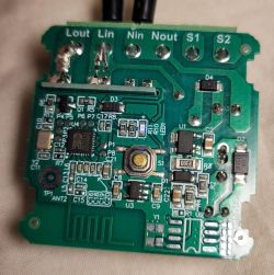 Close-up of a PCB with SMD parts, a push button, and solder pads labeled Lout, Lin, Nin, Nout, S1, S2.
