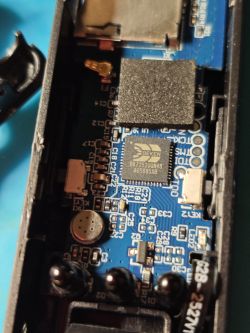 Electronics board with BEKEN chip and microphone Close-up of circuit board with BEKEN BK7252 chip and small microphone component