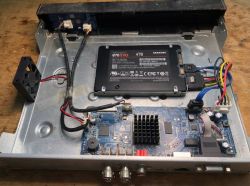 Open enclosure with Samsung 870 EVO 4TB SSD and electronic mainboard visible inside