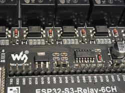 ESP32-S3-Relay-6CH board with electronic components Close-up of ESP32-S3 relay board with relays, capacitors, and labeled pins