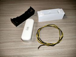 DIY WiFi Thermometer Parts Components for assembling a WiFi thermometer: a case, battery holder, sensor, and wires