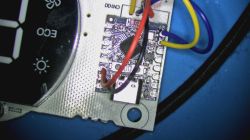 Close-up of a PCB module with colored wires connected next to an LED display labeled “ECO”.