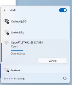 List of available Wi-Fi networks on a computer screen with the OpenRTL87X0C_553CA054 network selected and connecting.