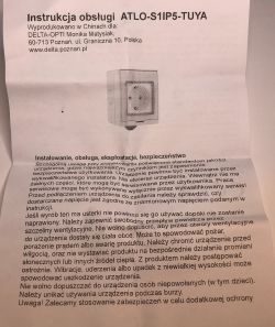 Instruction manual for the ATLO-S1IP5-TUYA device on paper, featuring a black-and-white illustration of the outlet.