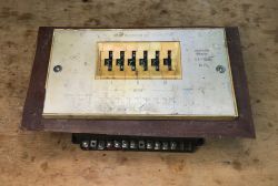 Old Soviet timing relay WL-34Y4 on a workshop table with numeric switches and terminals
