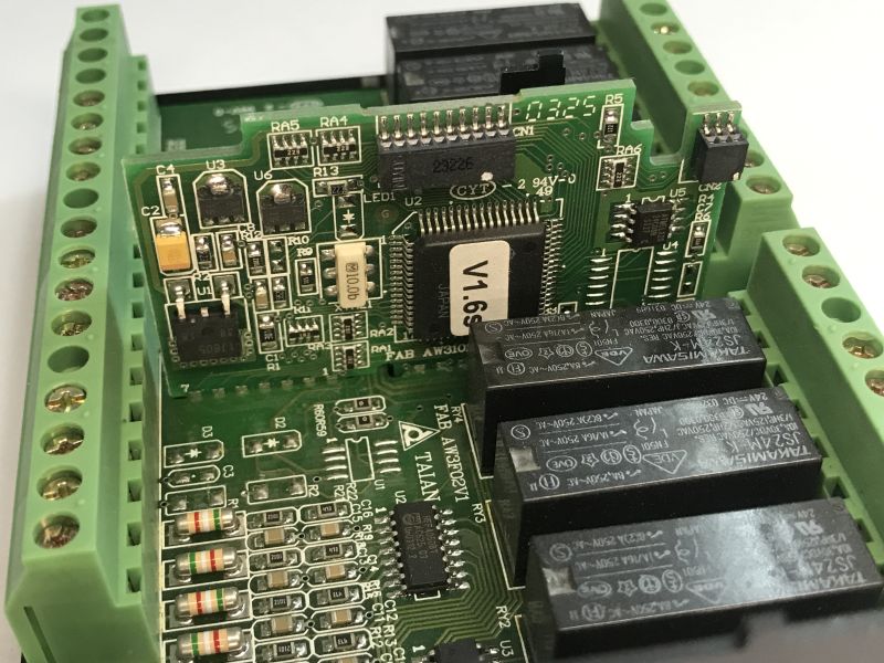 The interior of an old Schneider Electric SR1 A201BD programmable logic controller