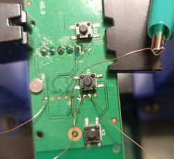 Circuit board with wires soldered to UART pins.