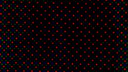 Zdjęcie przedstawia kolorowy wzór powiększonych pikseli procesora z X360 w kształcie czerwonych rombów i zielono-niebieskich kropek.