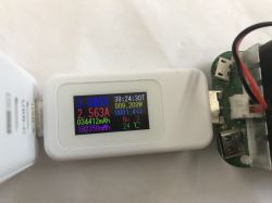 USB tester shows 3.593 V and 2.563 A, connected to a disassembled USB-C power supply.