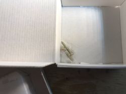 Contents of LXM170 Switch Box Screws in a transparent bag inside a box.