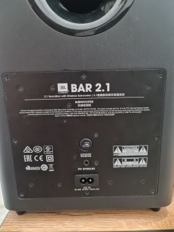 Back of JBL BAR 2.1 subwoofer with labels.