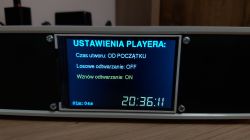 Player display with playback settings menu showing playback options and current time
