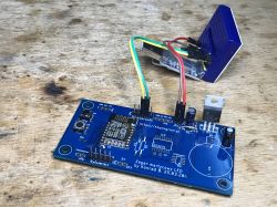 Electronic kit consisting of a PCB with an ESP8266 module and a connected relay component.