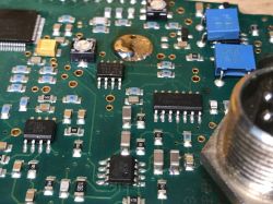 Metal detector PCB with visible components and damage.