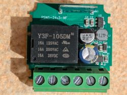 Close-up of an electronic module with a Y3F-105DM relay and circuit components.