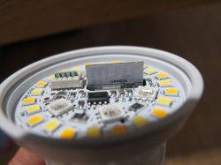 Interior of an LED bulb with visible diodes and electronic circuitry.