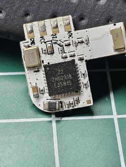 Close-up of the ZTLC9 electronic module from a switch, showing its components and connections.