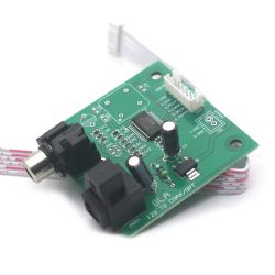 I2S to SPDIF converter on a green circuit board with Toslink and Coaxial ports.