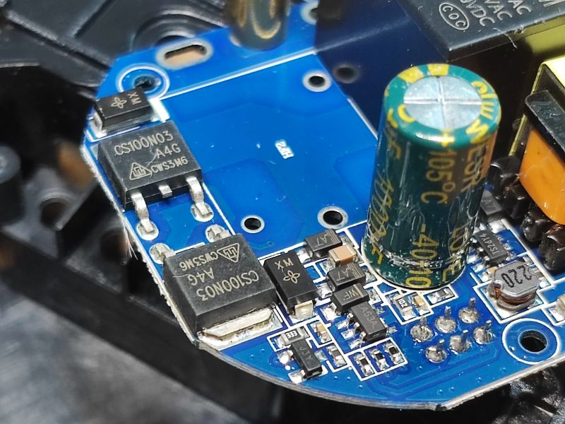 Close-up of QTouch Switch Internal Circuit Close-up of the internal electrical circuit of a QTouch switch with a capacitor and MOSFET transistor.