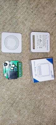 Components of a DIY smart switch, including a casing, PCB, and box.