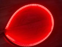 Red LED strip arranged in a teardrop shape.