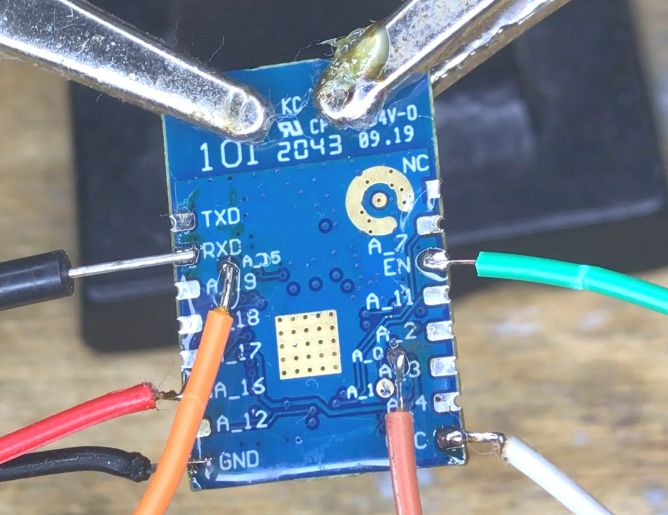 Tuya W701-VA2-CG Module with Soldered Wires Close-up of Tuya W701-VA2-CG module with soldered wires.