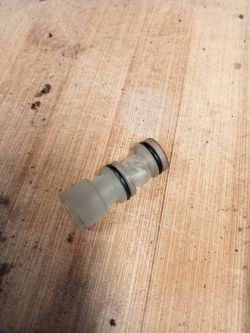 Hydraulic connector on a wooden surface