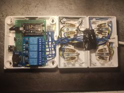 DIY Aquarium Controller with ESP8266 and Relays Interior of a homemade aquarium controller with ESP8266 module, relays, and 230V wiring visible.