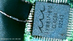 Image of TXW817-810 chip with a soldered copper wire.