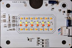 Circuit board with a light module, LEDs, and electronic components.