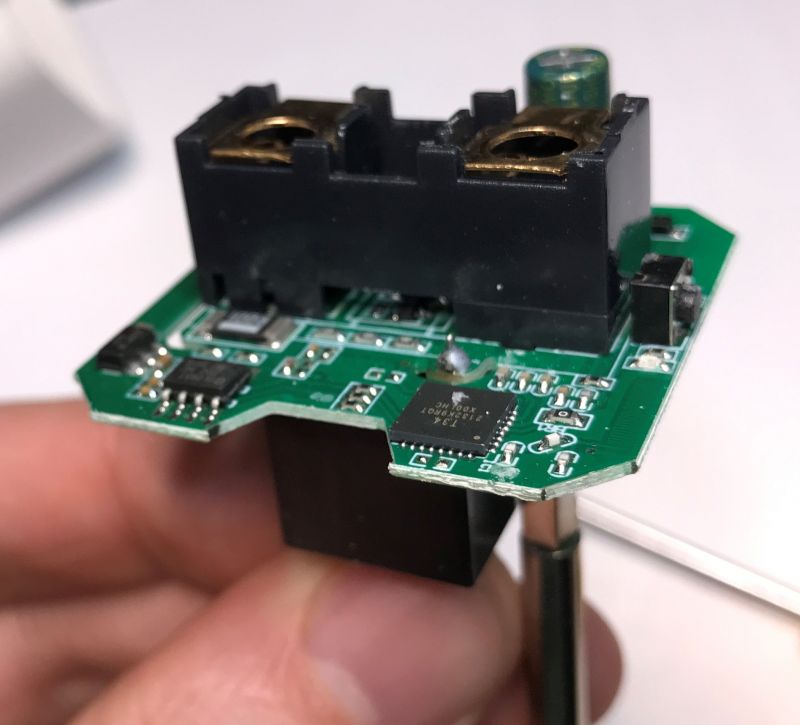 Printed Circuit Board with Electronic Components Close-up of a small printed circuit board with electronic components, held in hand.