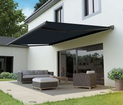 Patio with an outdoor canopy and garden furniture