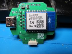 Close-up of an electronic module with a label showing model WBR3 and a QR code.
