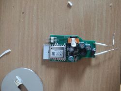 Disassembly and Modification of ExtraStar A60WIFI-2 Bulb Disassembled ExtraStar A60WIFI-2 smart bulb with exposed electronics and soldered connection points.