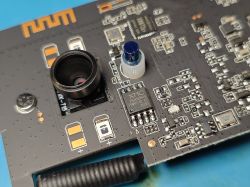 Close-up of a PCB with camera lens and XMC microcontroller