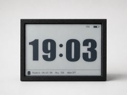 E‑paper display in a black frame showing large time 19:03 and a 78% battery icon