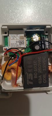 Interior of an electronic device with visible components and wiring.