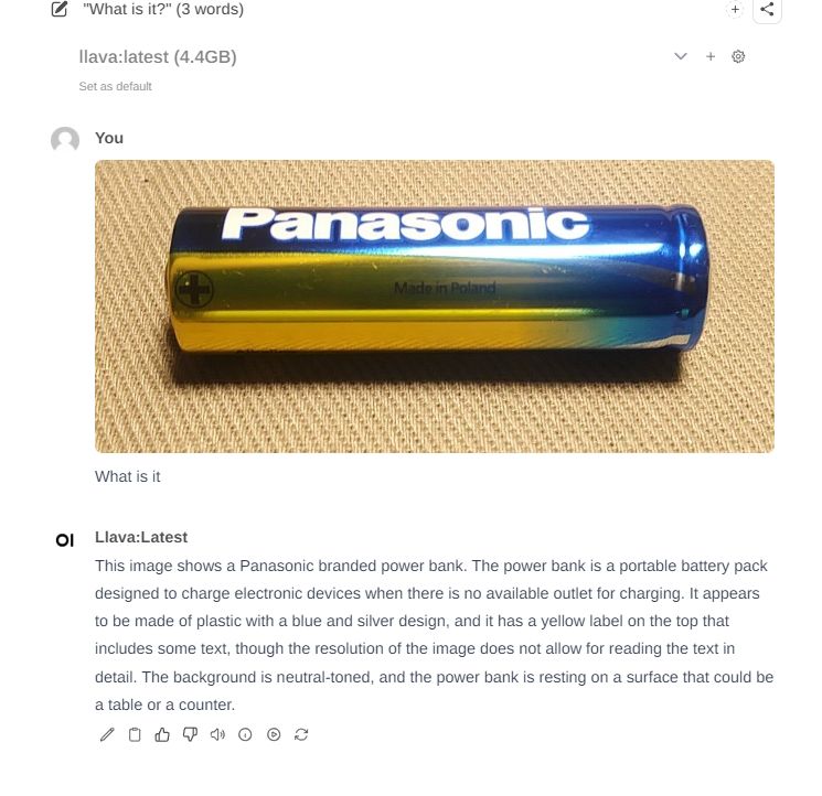 Close-up of a Panasonic battery on a neutral surface.