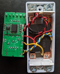 Interior of an AliExpress Energy Meter Interior of an energy meter showing a circuit board and wiring.